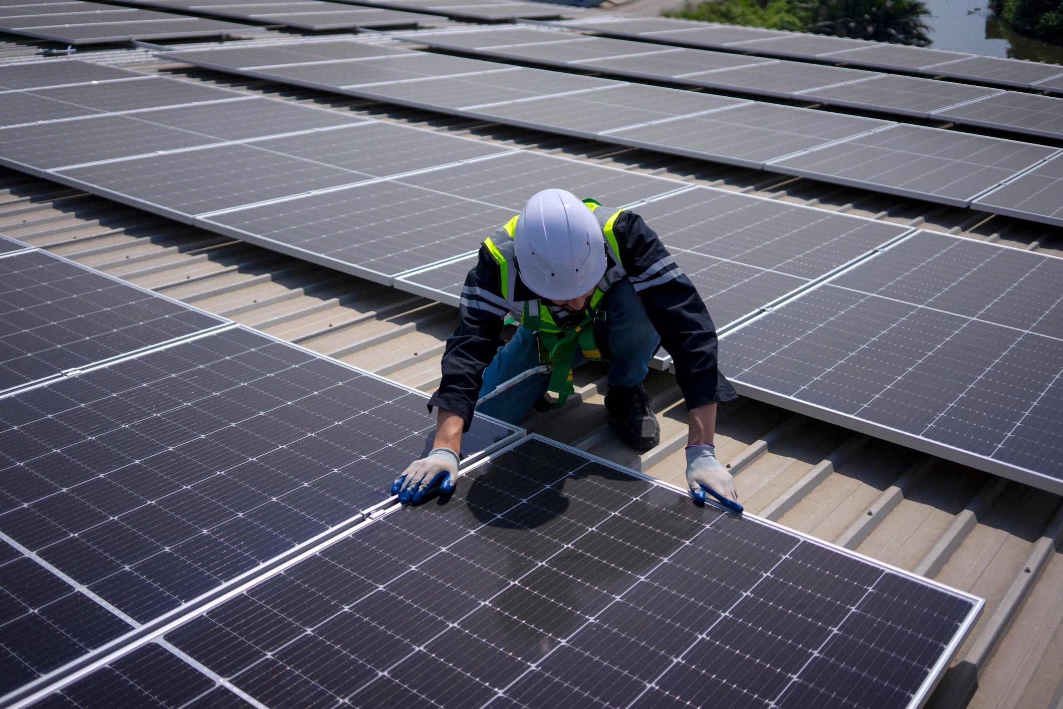 Solar technician on a rooftop used as supporting image for client testimonial
